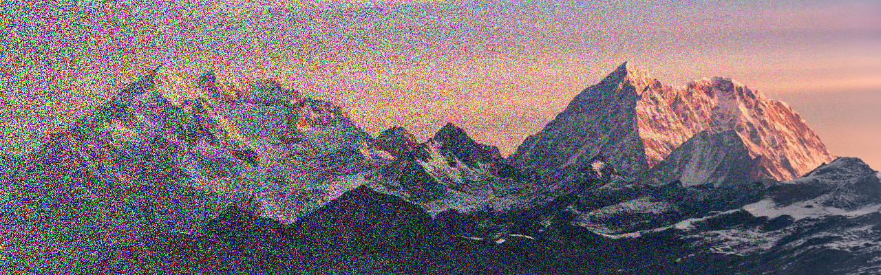 A noisy image of a mountain range, with the level of noise gradually decreasing from left to right.